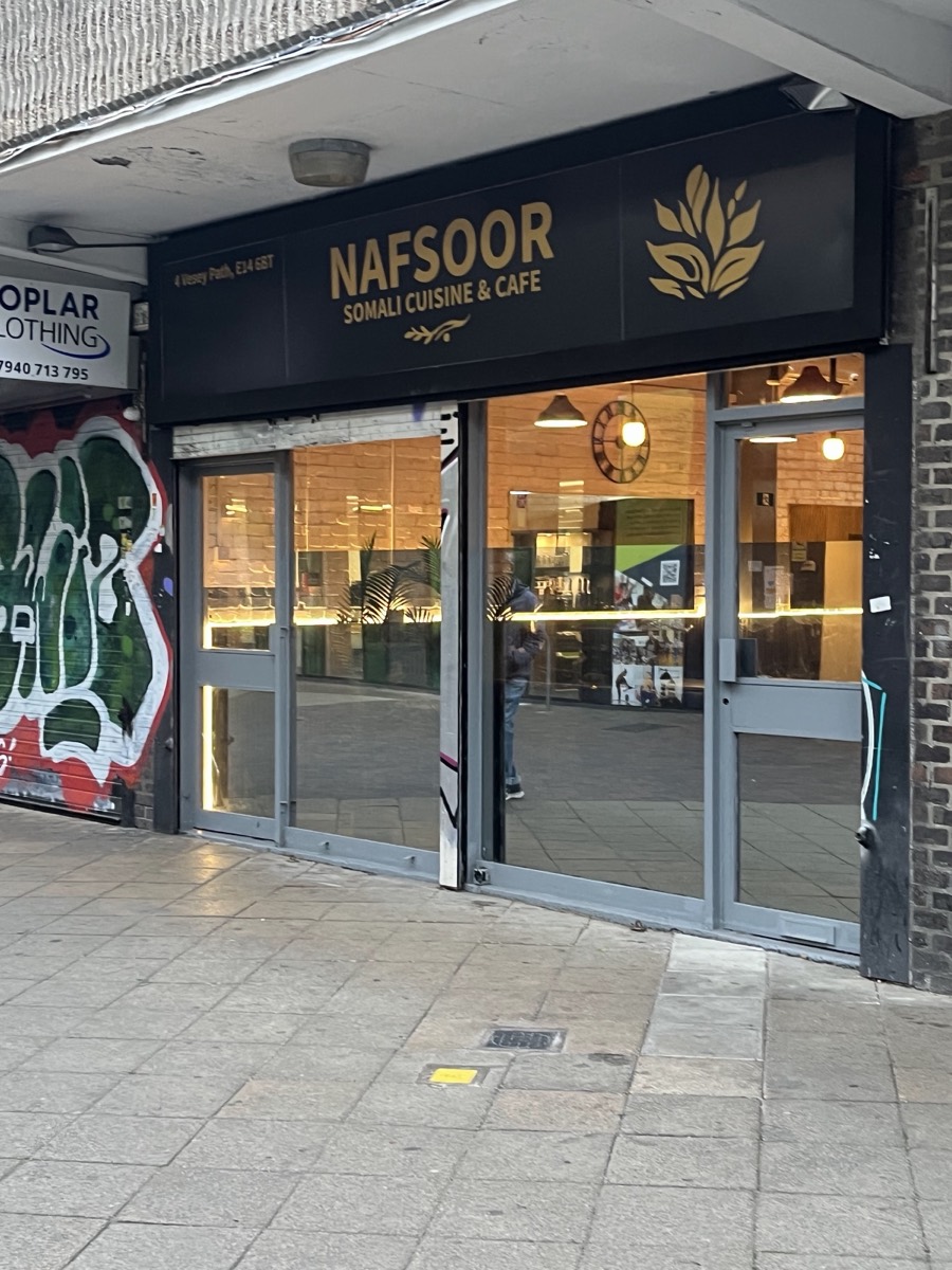 The Nafsoor shopfront at dusk on Vesey Path, gold signage lit above the warm dining room